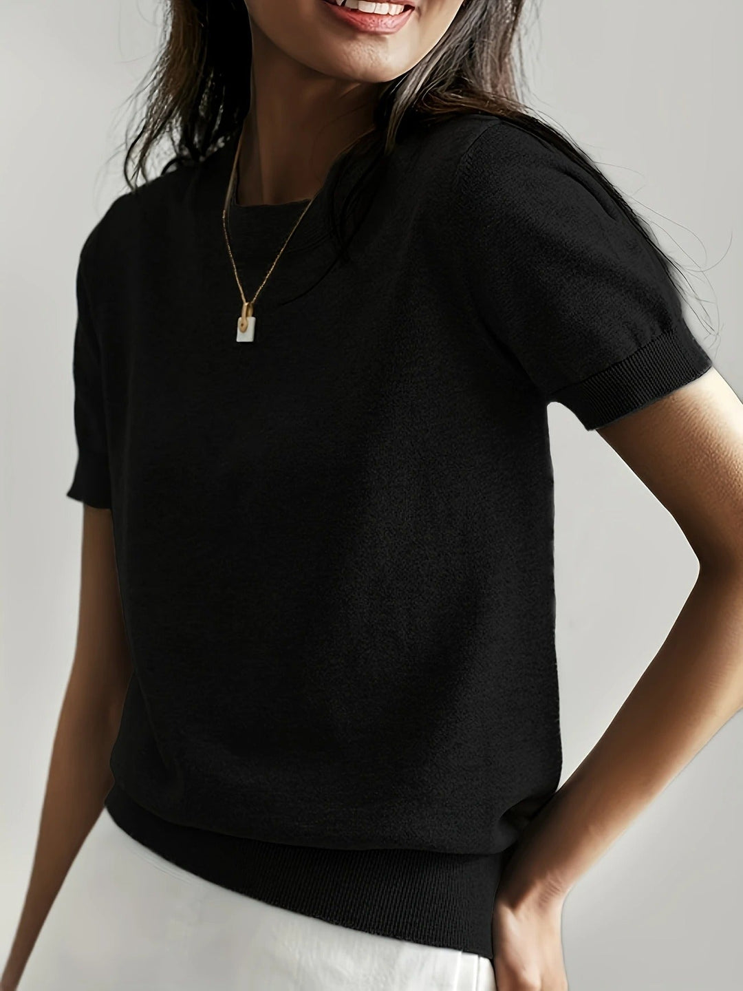 Green women's essential crew neck ribbed short sleeve tee, for comfortable daily wear.