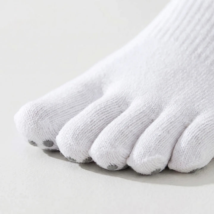 Women's athletic five-toe grip socks in white, designed for enhanced balance and stability in yoga & pilates.