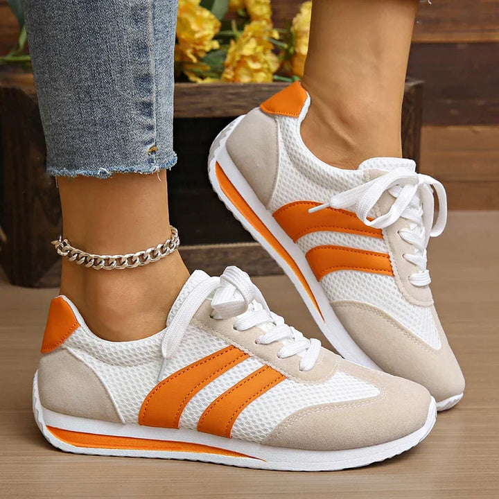 Women's white lace-up low-top sneakers for casual everyday style & comfort.