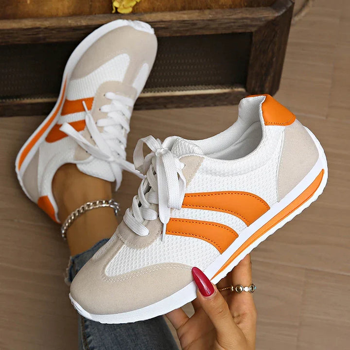Stylish women's low-top lace-up sneakers, perfect for casual everyday outfits & comfortable walking.