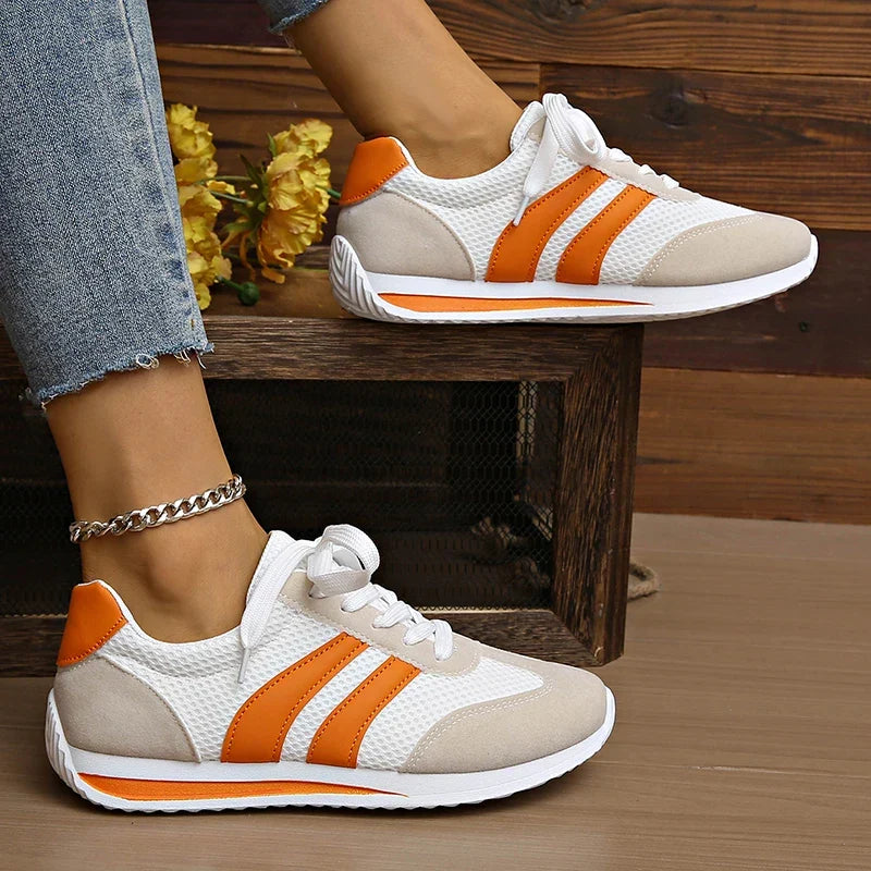 Versatile women's lace-up low-top sneakers for everyday wear, offering comfort and modern style.