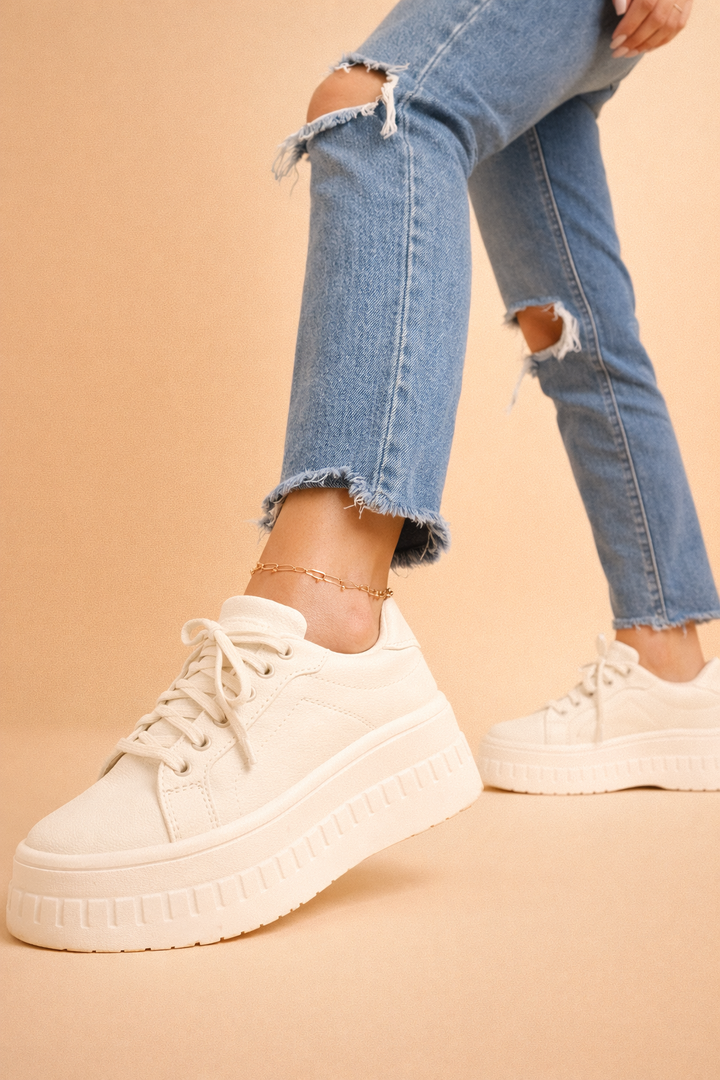 Trendy women's platform sneakers with a high sole, offering elevated style and comfort for casual outfits.