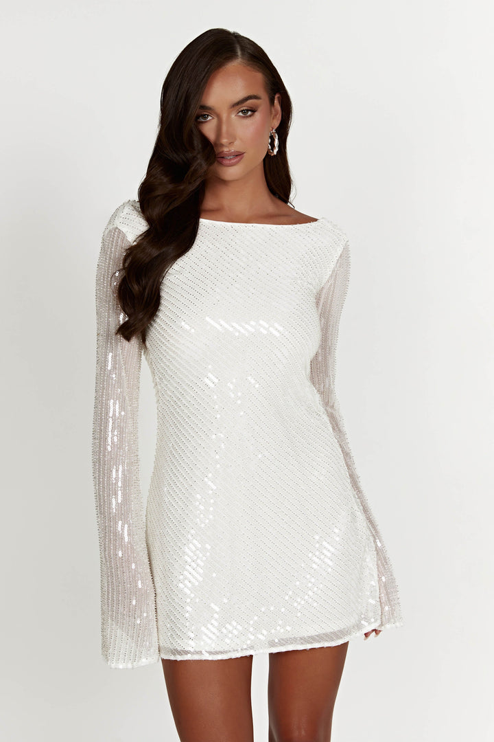 Elegant open back of a white sequin mini dress, showcasing a chic design for party nights.