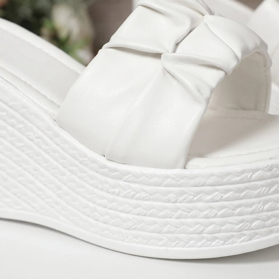 Comfortable white women's slip-on wedge sandals with open toe, great for summer vacations & casual ease.