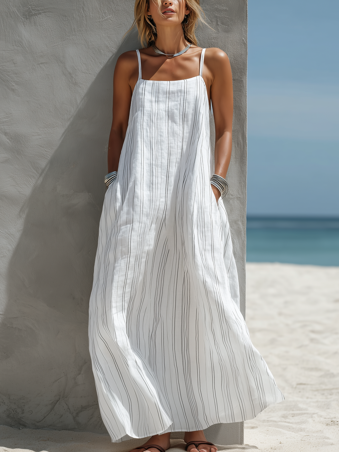 Women's white striped maxi dress with spaghetti straps & square neck, perfect for beach, summer, or resort wear.