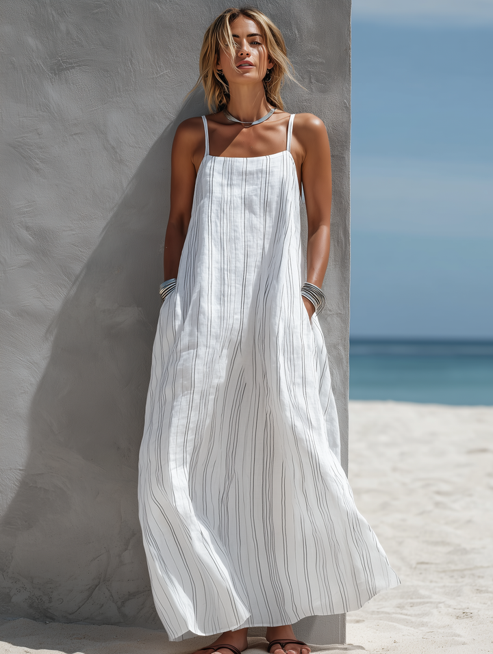 Elegant women's white striped maxi dress featuring spaghetti straps & square neckline for a chic summer day look.
