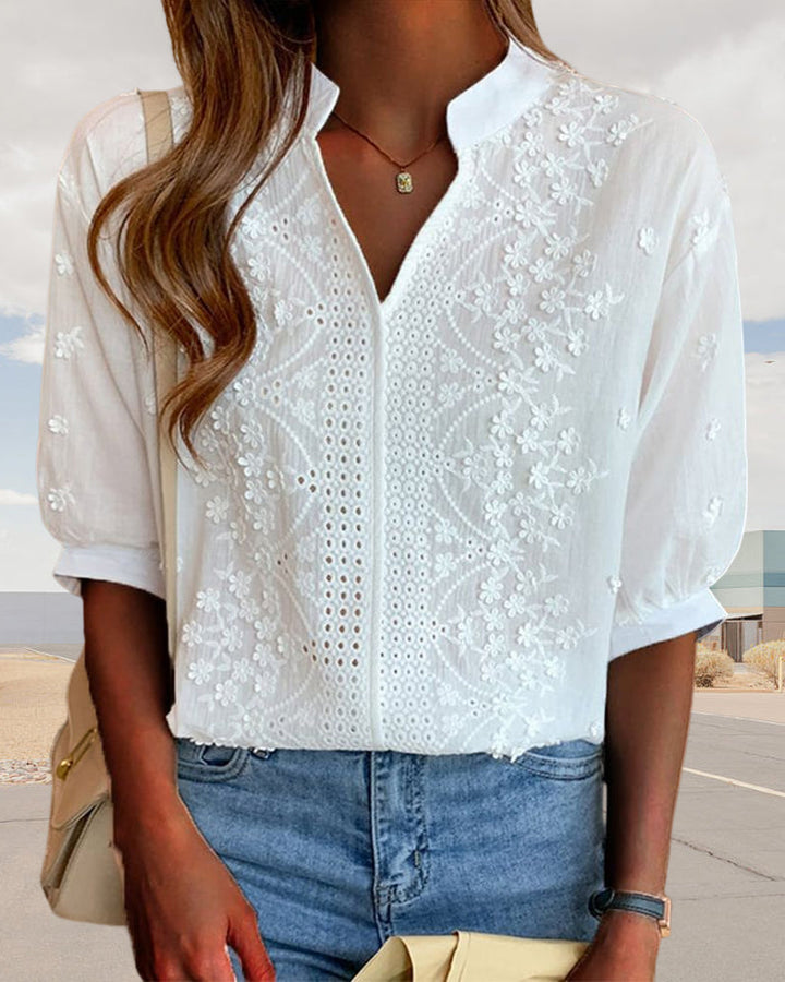 Stylish women's puff sleeve V-neck blouse with a unique patchwork design.