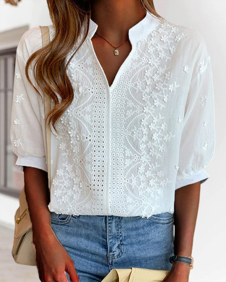 Women's casual chic V-neck top with puff sleeves and a modern patchwork style.