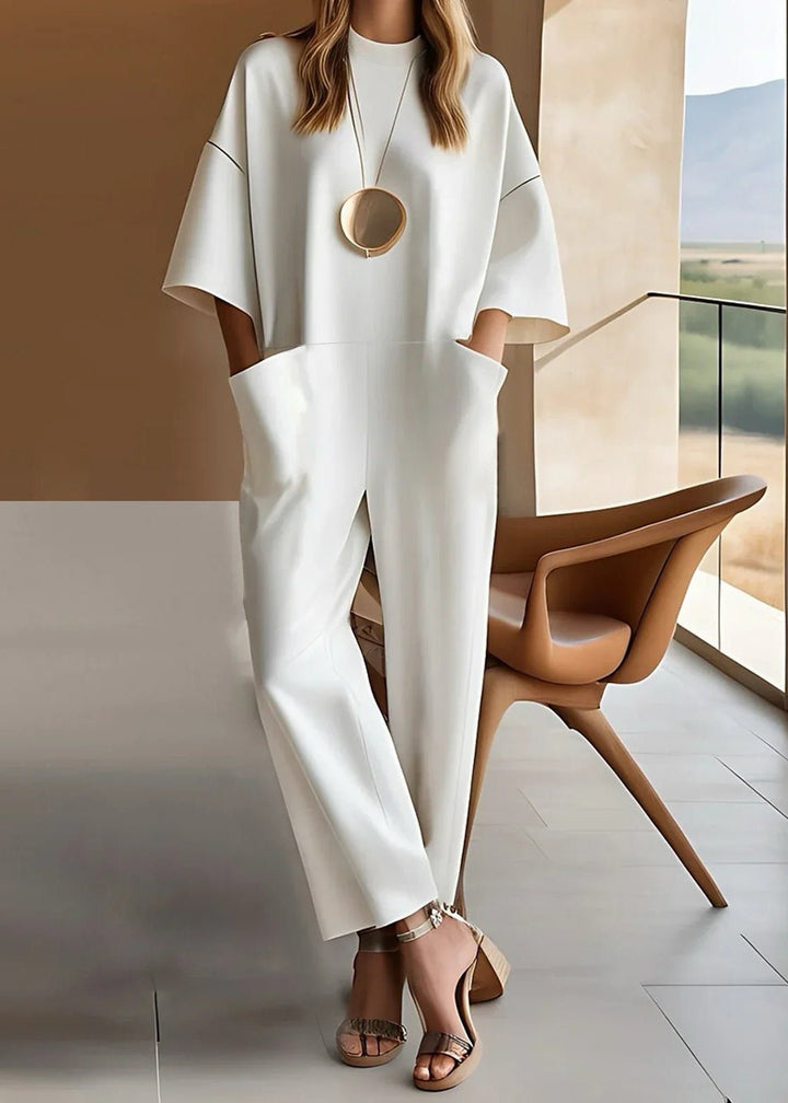 Women's white wide leg jumpsuit with short sleeves & crew neck. Effortless, comfortable & stylish summer fashion.