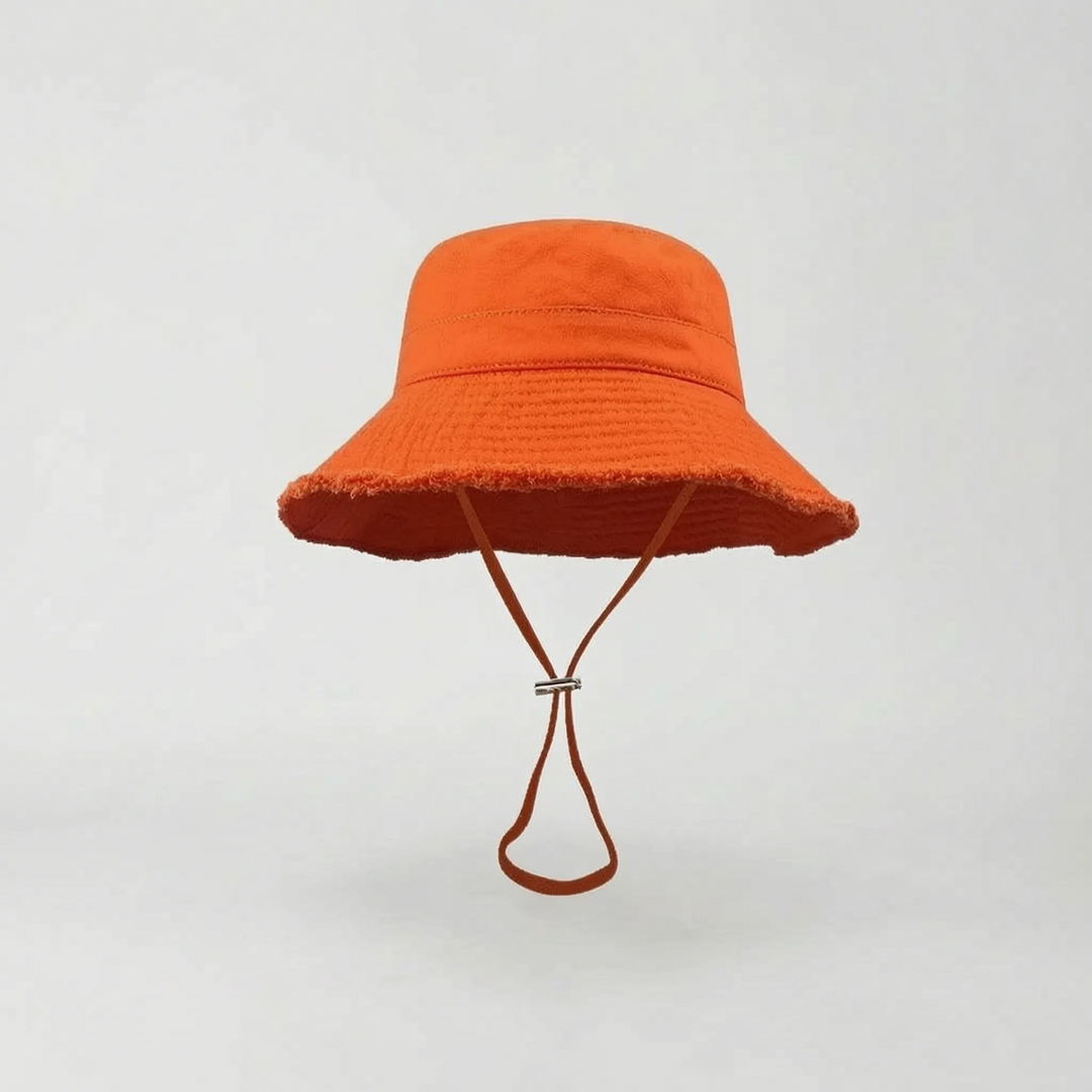 Stylish women's wide brim bucket hat, versatile for beach, travel, and everyday summer wear.