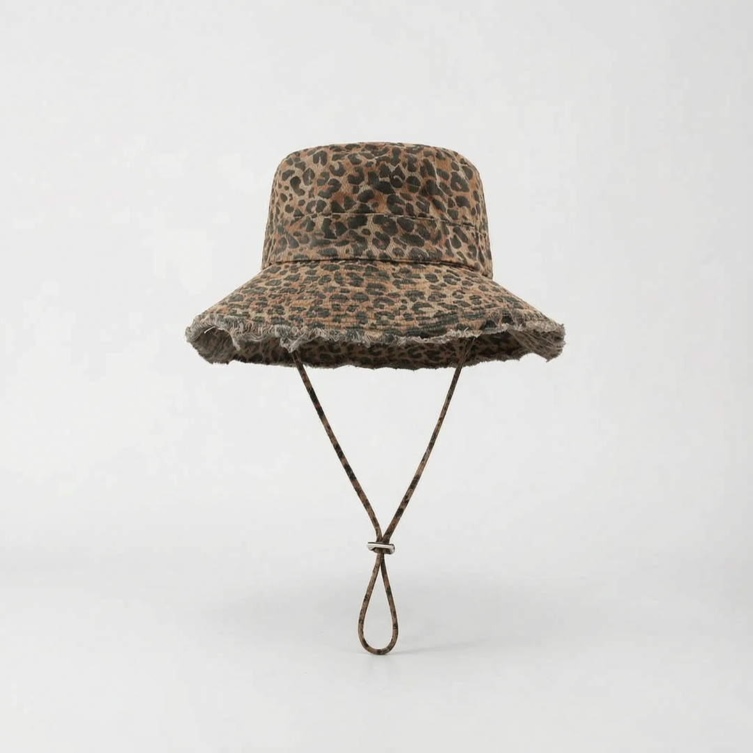 Trendy leopard print wide brim bucket hat for women, stylish sun protection beach accessory.