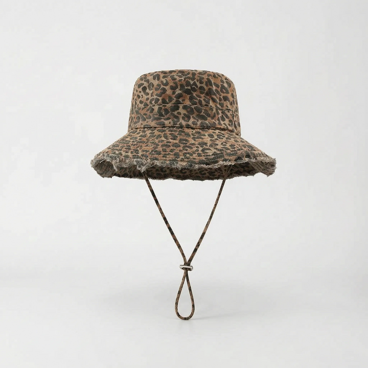 Trendy leopard print wide brim bucket hat for women, stylish sun protection beach accessory.