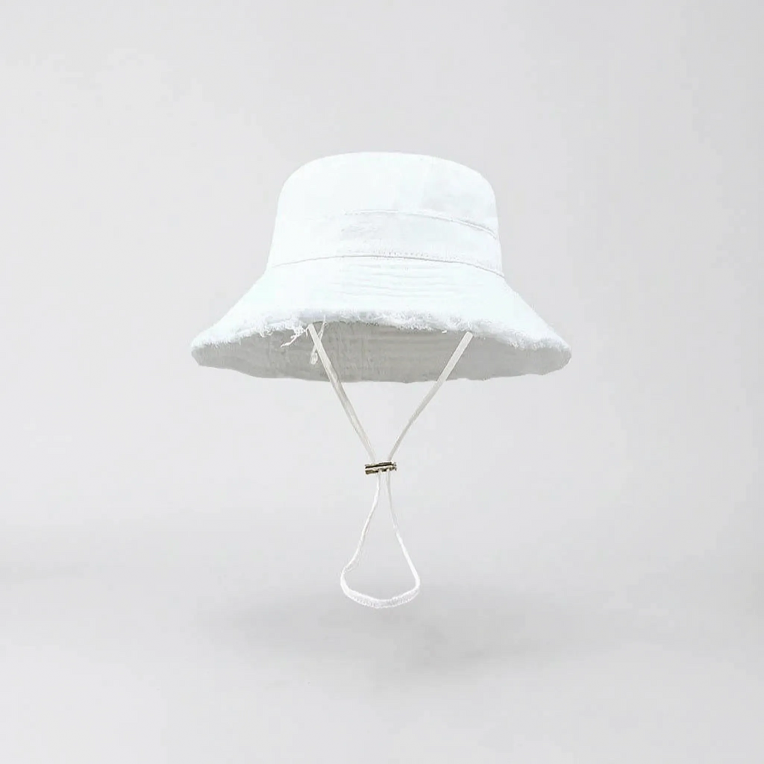 Chic pink wide brim bucket hat for women, offering fashionable sun protection & summer style.