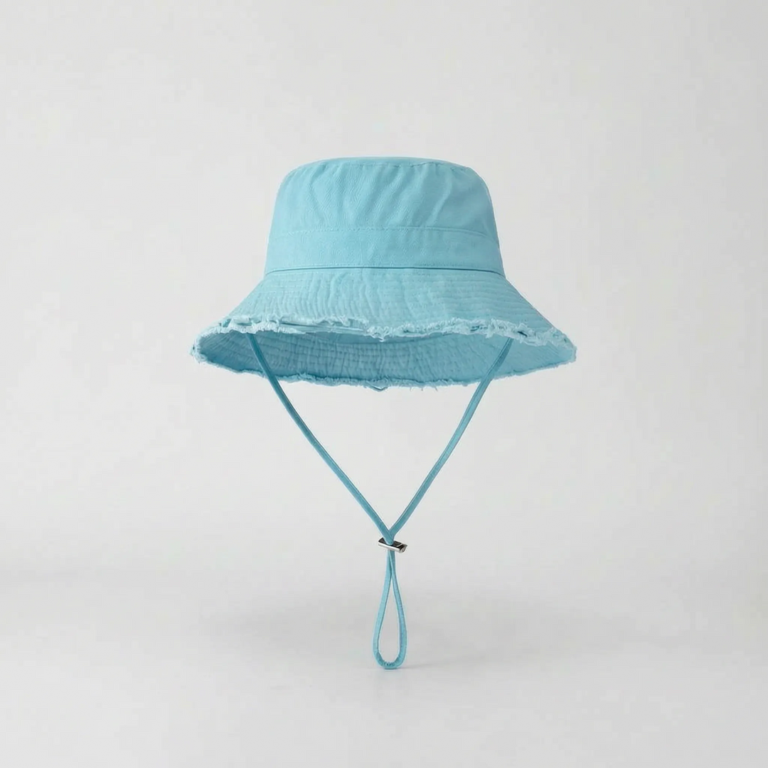 Women's sun protection wide brim bucket hat, packable & adjustable, for beach and travel.
