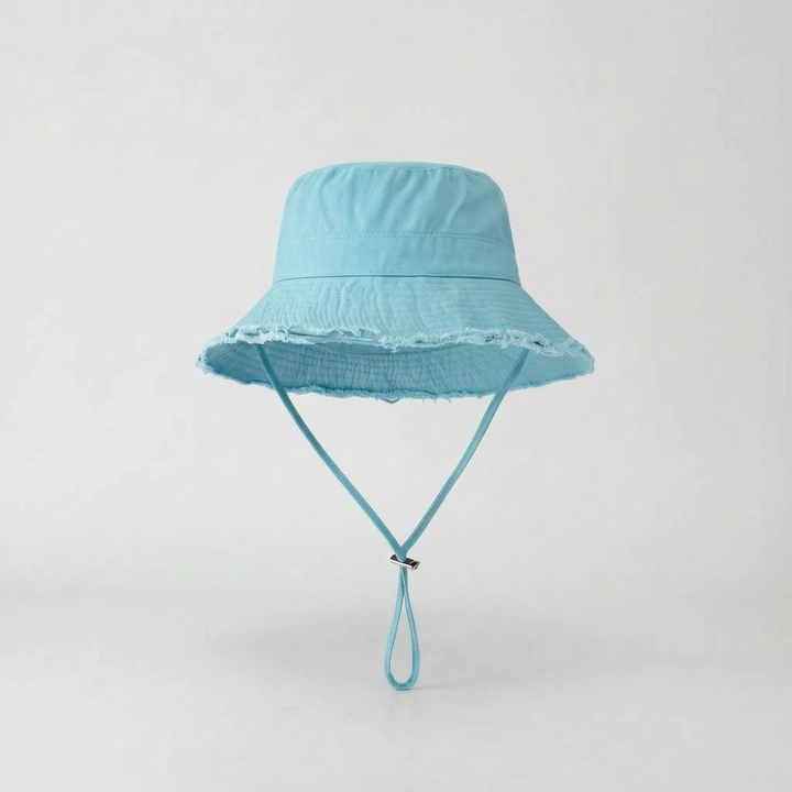 Women's sun protection wide brim bucket hat, packable & adjustable, for beach and travel.