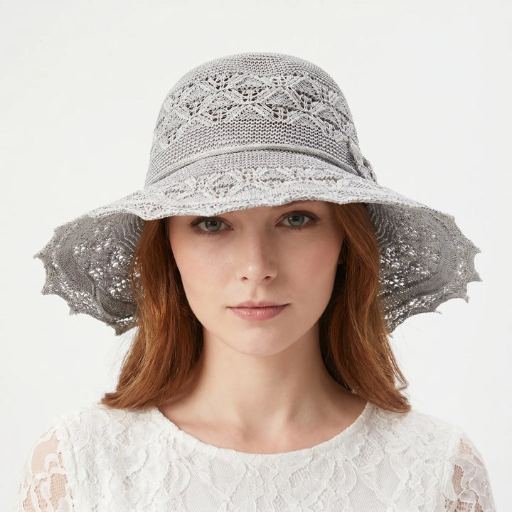 Foldable wide brim sun hat for women, perfect for travel & easy packing. Stylish beach & vacation accessory.