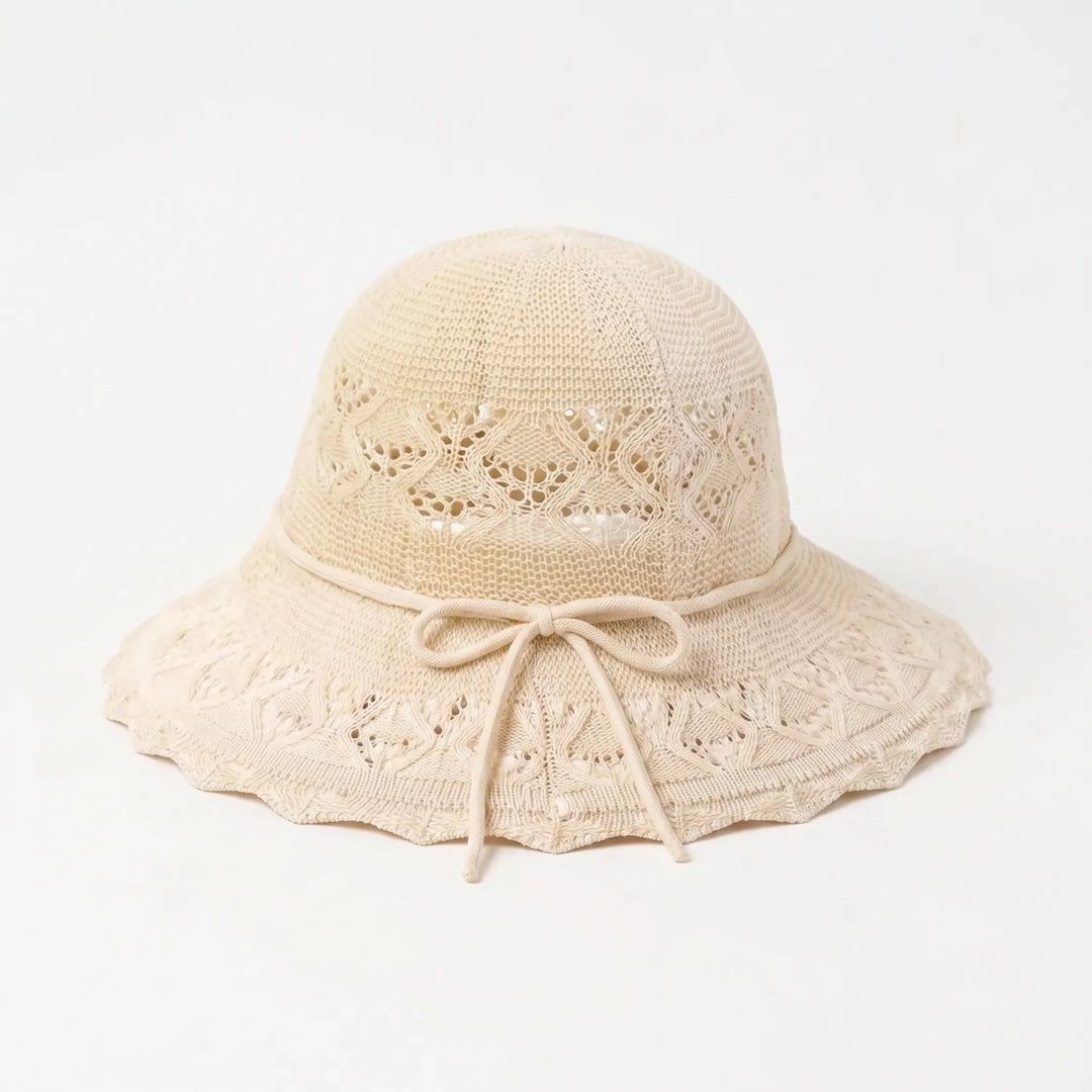 Elegant women's wide brim beach hat, perfect for summer sun protection & a stylish vacation look.