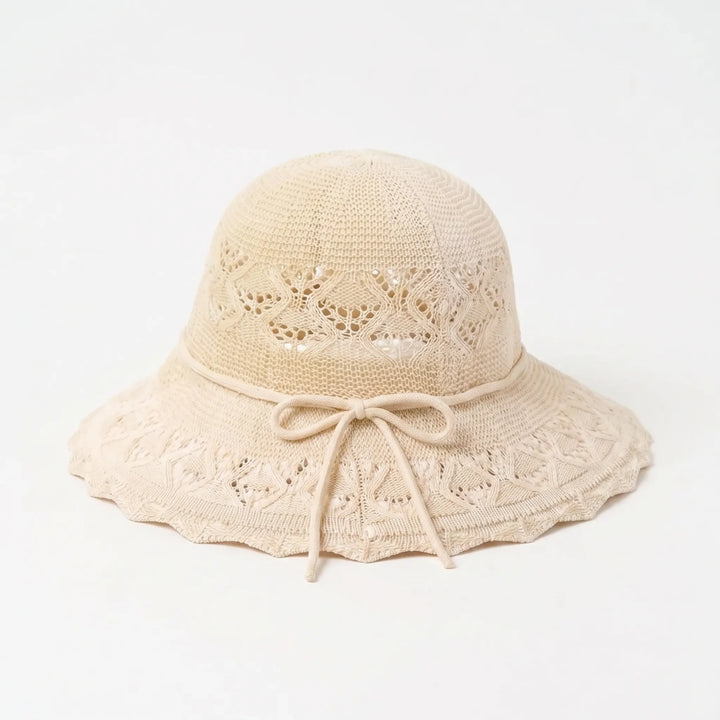 Elegant women's wide brim beach hat, perfect for summer sun protection & a stylish vacation look.