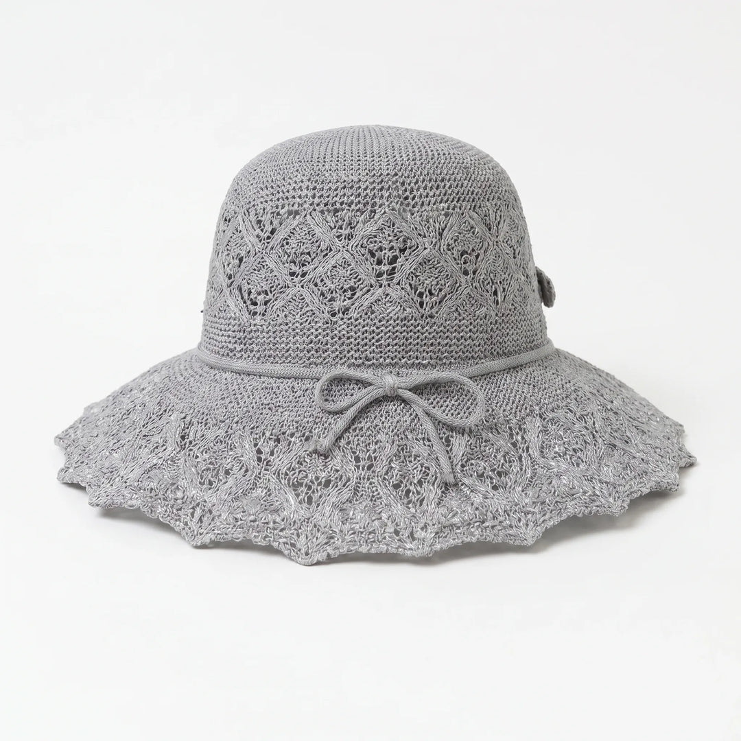 Women's chic wide brim sun hat, designed for stylish sun protection during outdoor adventures & travel.