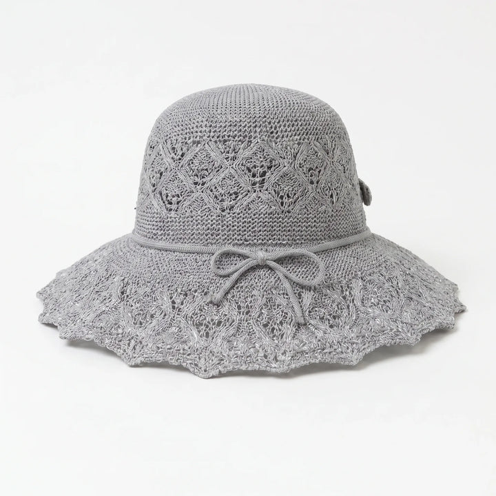 Women's chic wide brim sun hat, designed for stylish sun protection during outdoor adventures & travel.