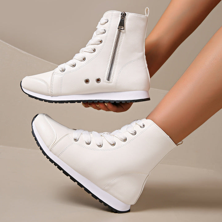 Stylish women's wide-fit orthopedic lace-up sneakers, essential comfort footwear for daily wear.