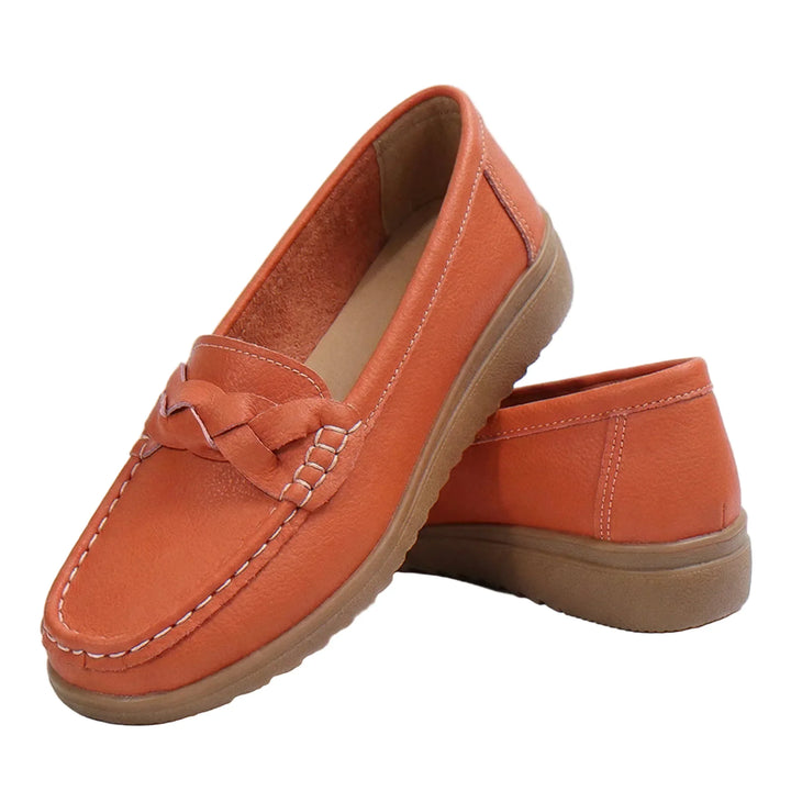 Women's wide fit orthopedic loafers in black leather with robust arch support.