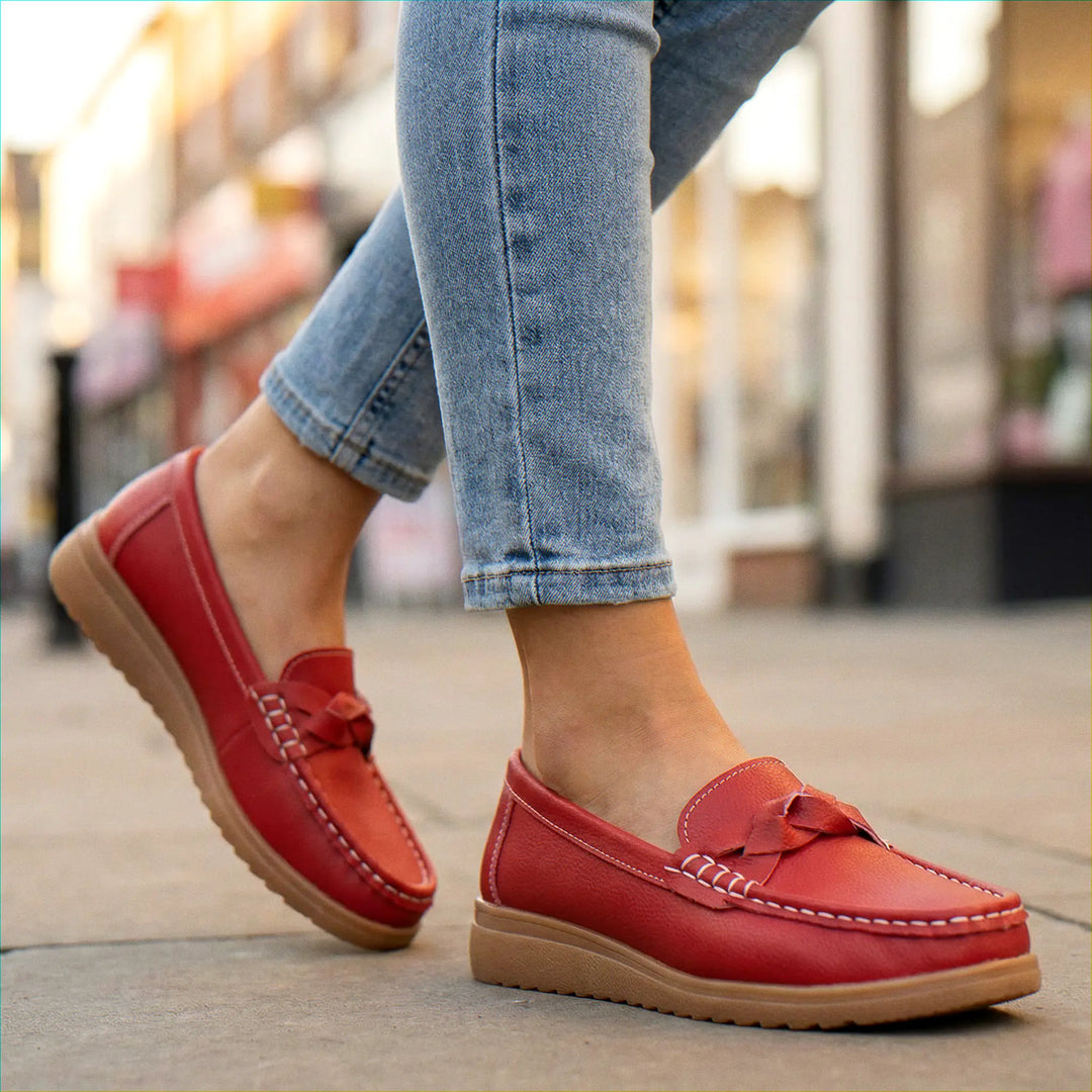 Women's navy slip-on loafers, wide fit and arch support for comfortable long days.