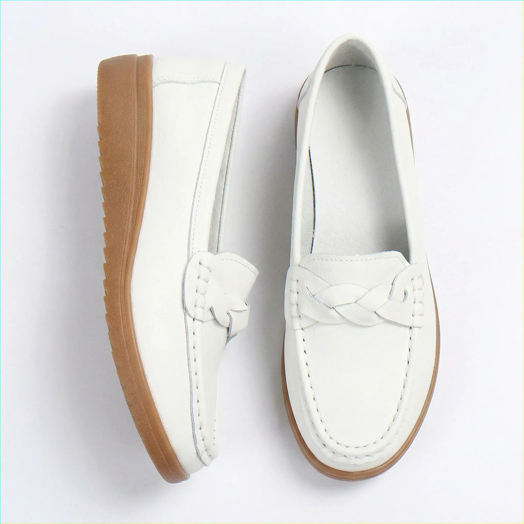 Side profile of comfortable women's loafers with all-day arch support technology.