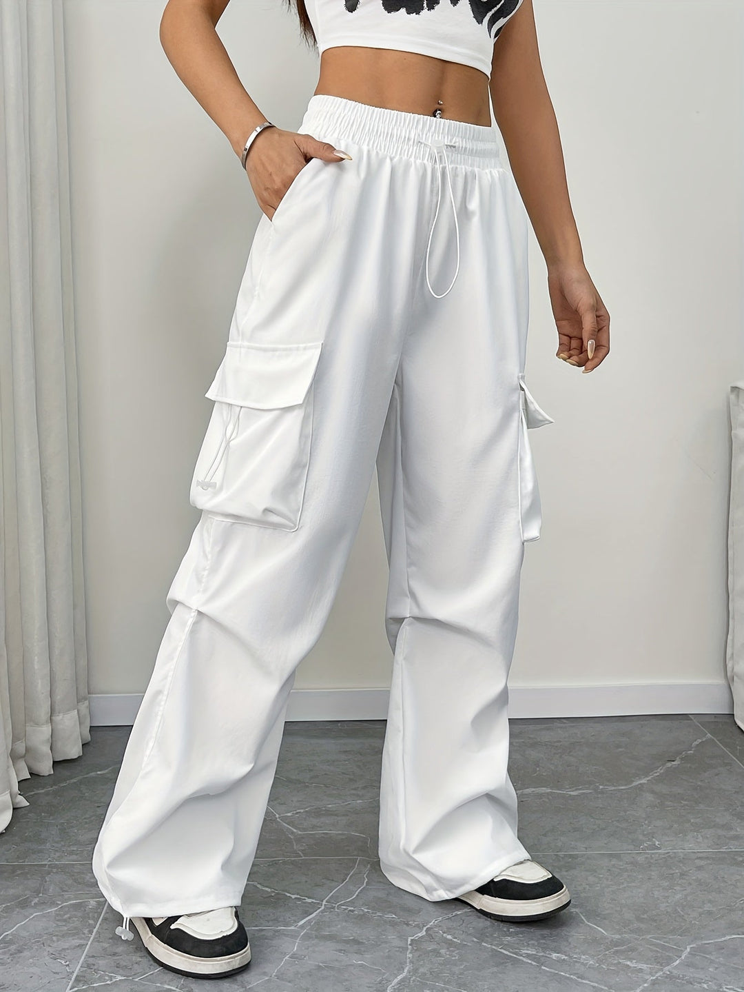 Women's wide leg cargo pants with drawstring waist, ideal for casual streetwear fashion.