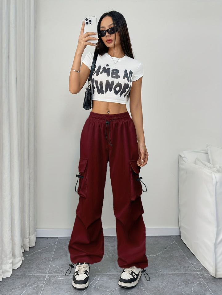 Front view of women's fashion wide leg cargo pants, showcasing the adjustable drawstring waist and side pockets.
