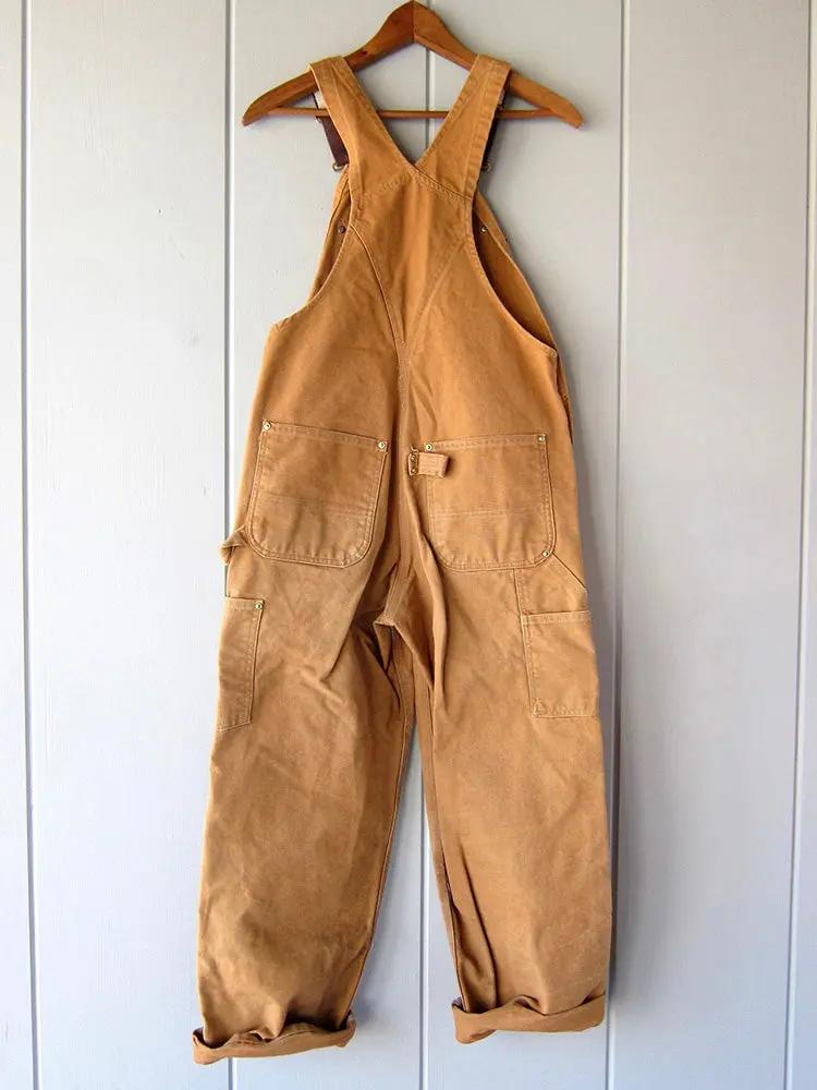 Comfortable women's utility-style wide-leg overalls. Relaxed fit jumpsuit for versatile casual wear.