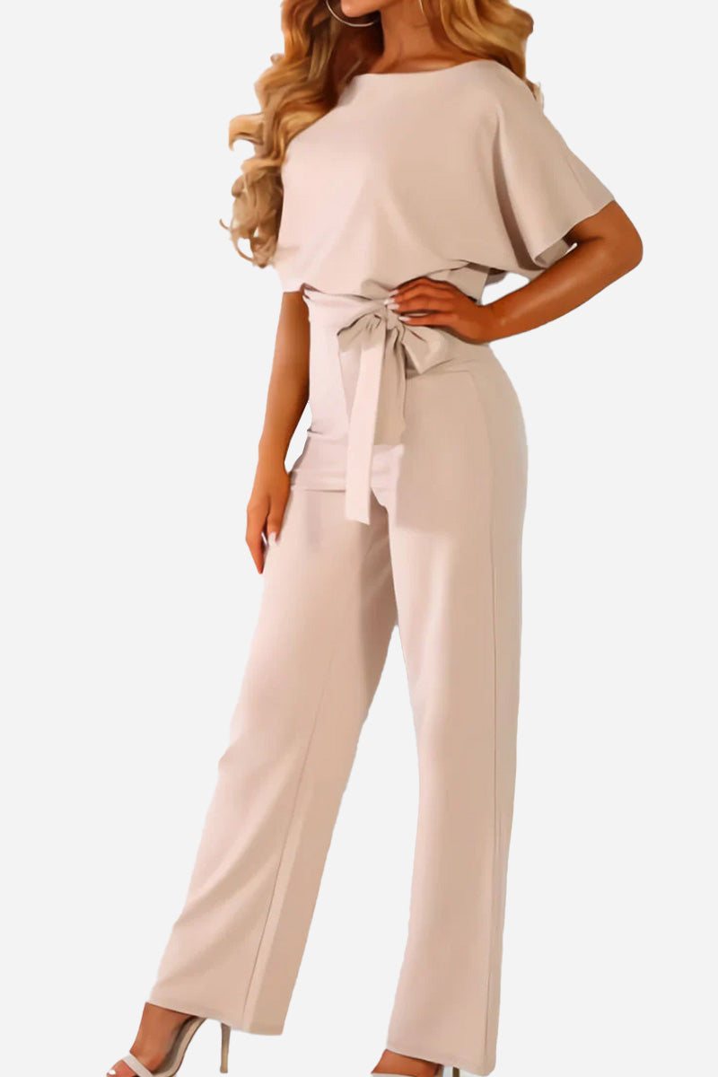 Chic wide-leg jumpsuit for women, featuring comfortable batwing sleeves & flattering belt. Ideal for evening wear.