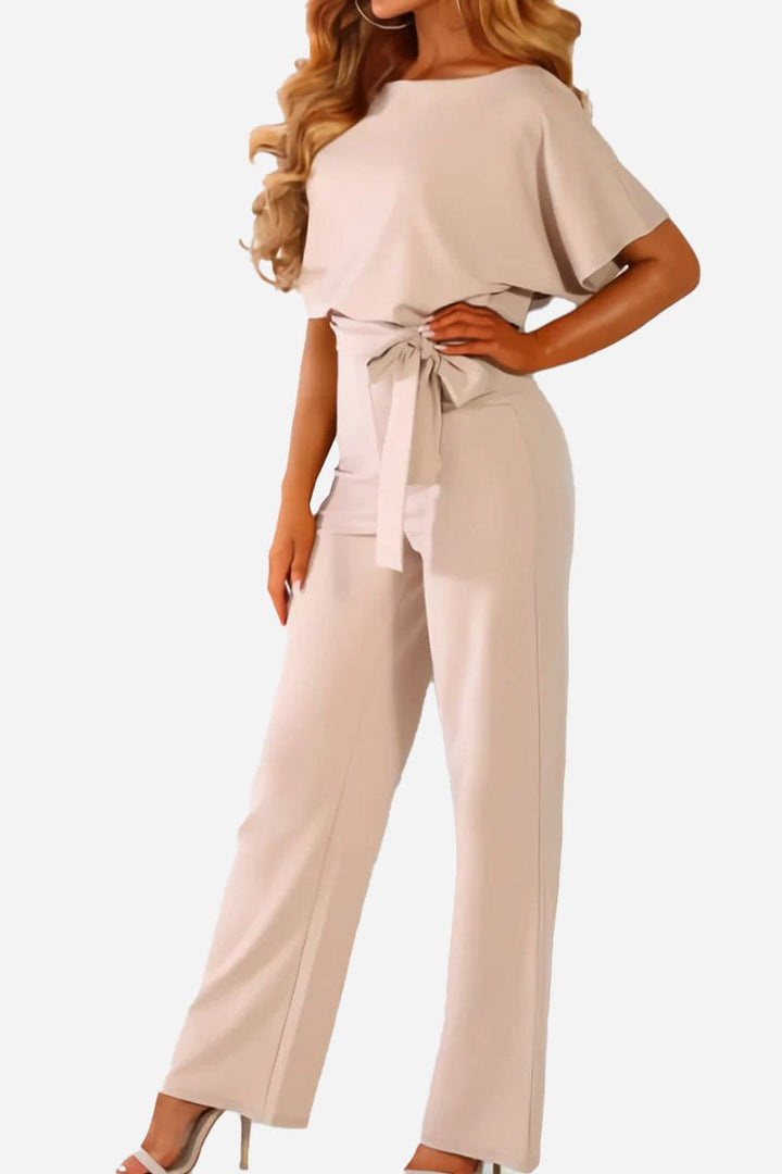 Chic wide-leg jumpsuit for women, featuring comfortable batwing sleeves & flattering belt. Ideal for evening wear.