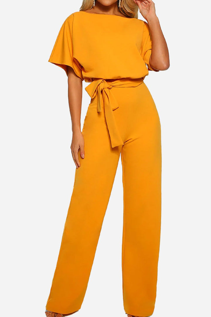 Effortless style: Women's versatile wide-leg jumpsuit with batwing sleeves & belt. Comfortable one-piece outfit.