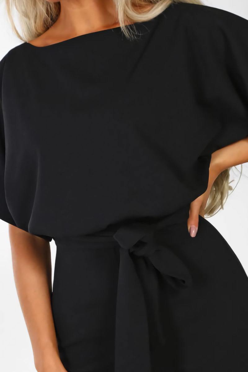 Stylish women's wide-leg jumpsuit. Comfortable one-piece with batwing sleeves & belt, ideal for summer or evening.