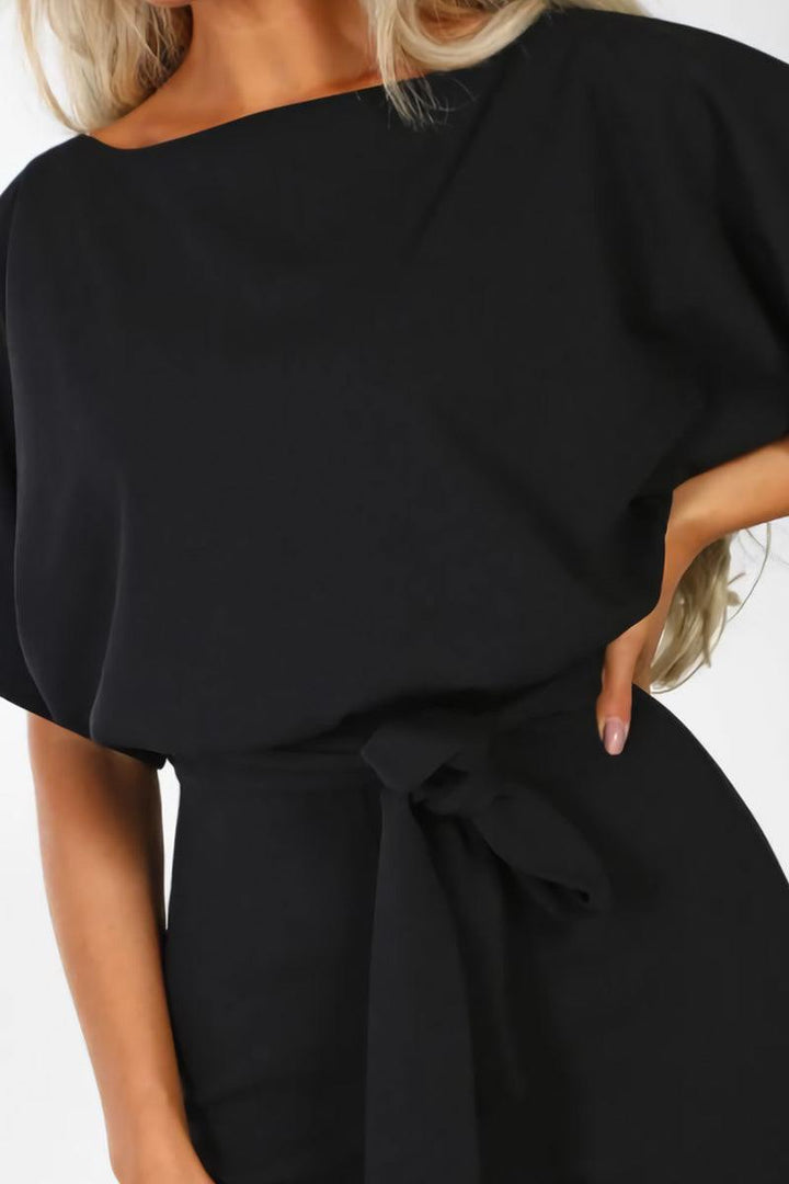 Stylish women's wide-leg jumpsuit. Comfortable one-piece with batwing sleeves & belt, ideal for summer or evening.