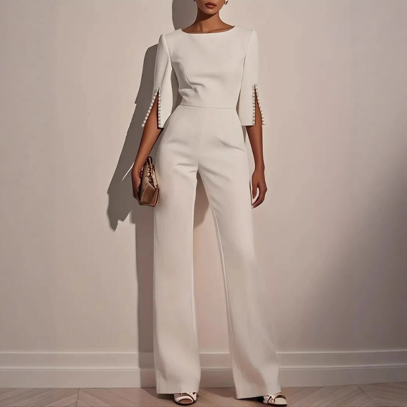 Women's wide leg jumpsuit with elegant pearl detail on sleeves, perfect for chic spring & summer fashion.