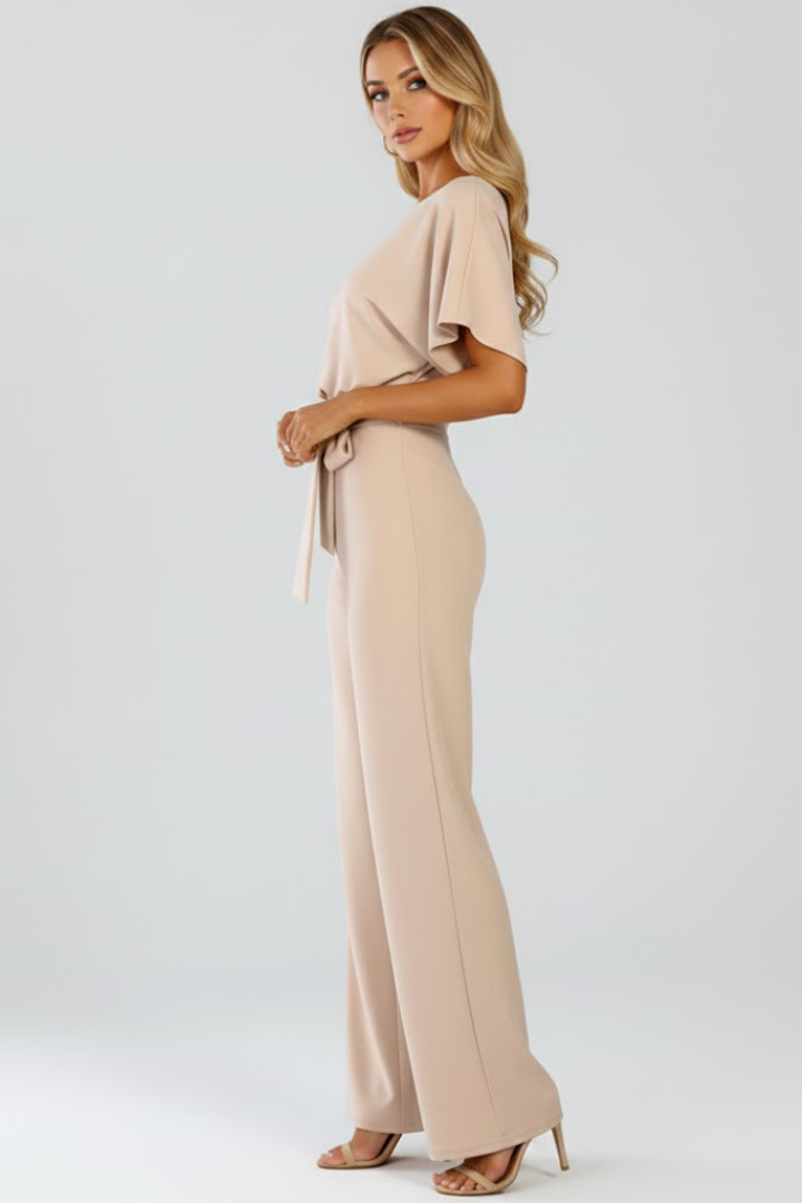 Stylish women's short sleeve wide leg jumpsuit, featuring a flattering belt. Ideal for summer fashion.