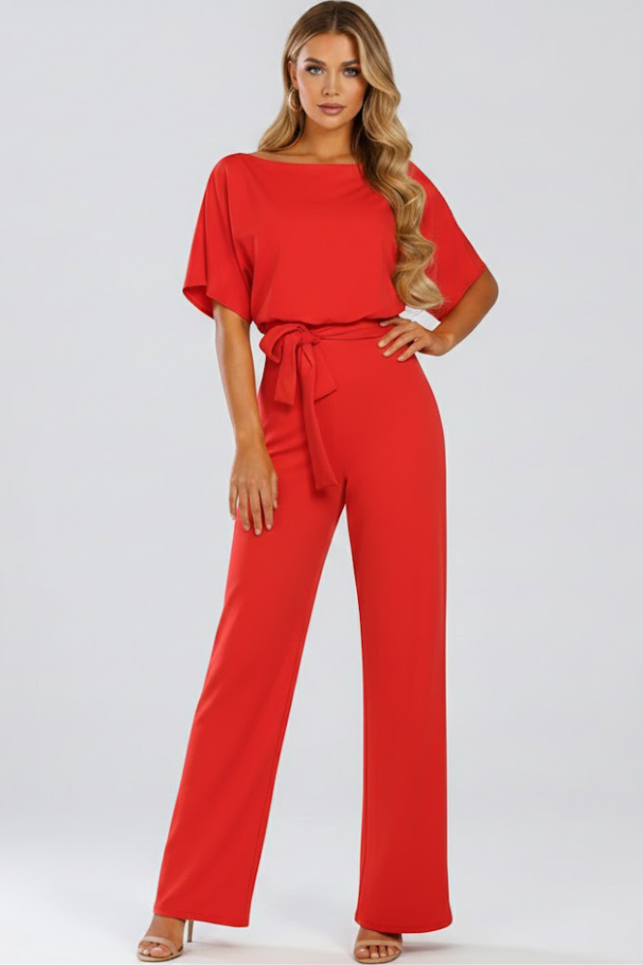 Flowy women's wide leg short sleeve jumpsuit with a belt, offering comfortable and elegant summer style.