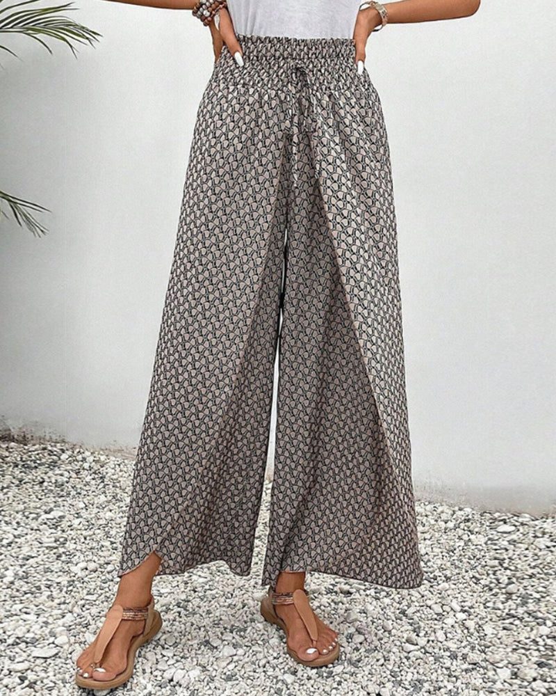 Comfortable women's wide leg pants with a bold geometric pattern. Relaxed fit ideal for everyday wear.