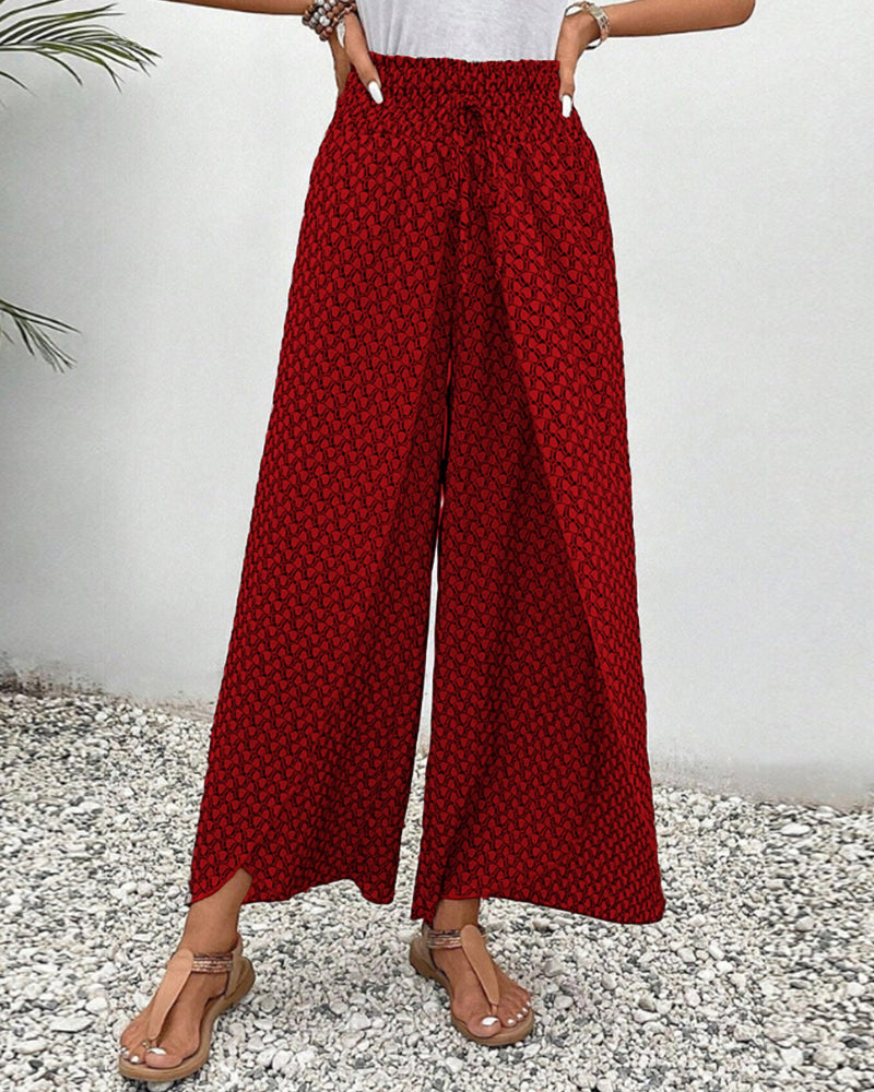 Women's relaxed fit wide leg trousers with a modern geometric print. Versatile & comfortable patterned pants.