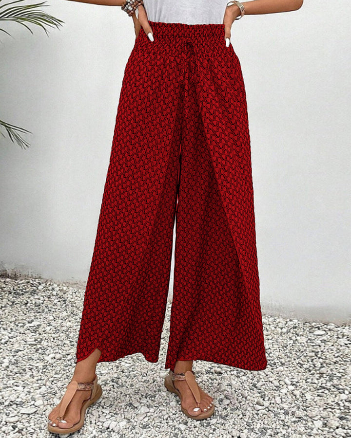 Women's relaxed fit wide leg trousers with a modern geometric print. Versatile & comfortable patterned pants.