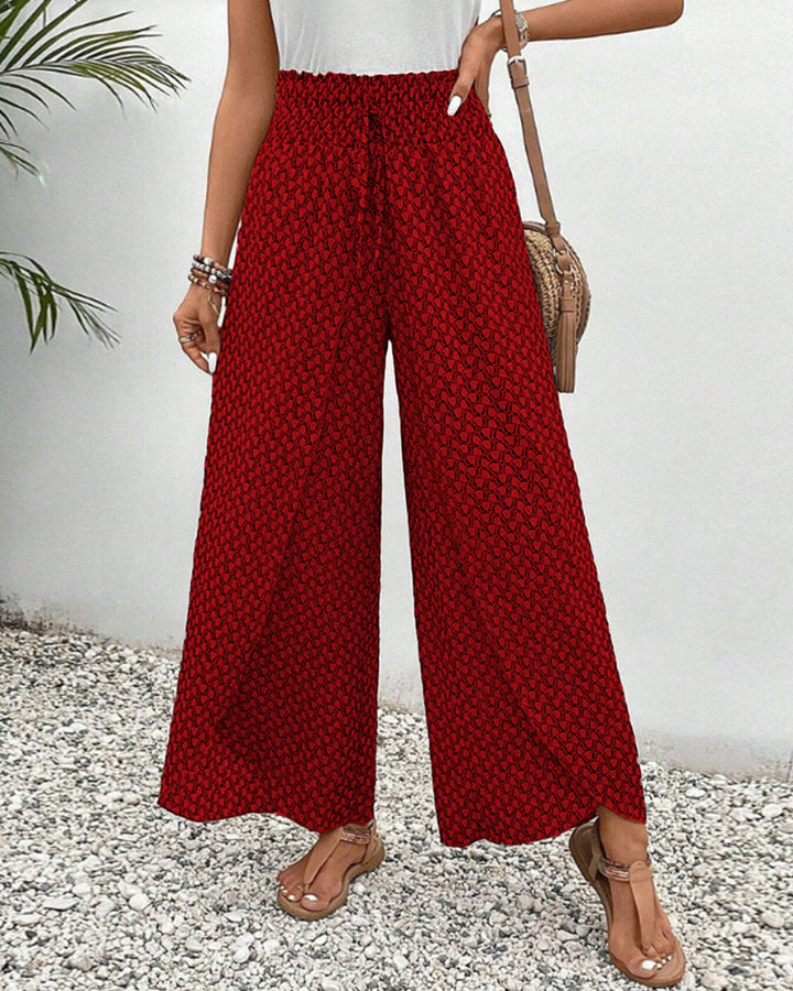 Versatile women's geometric print wide leg trousers. Relaxed fit design for stylish comfort and ease.