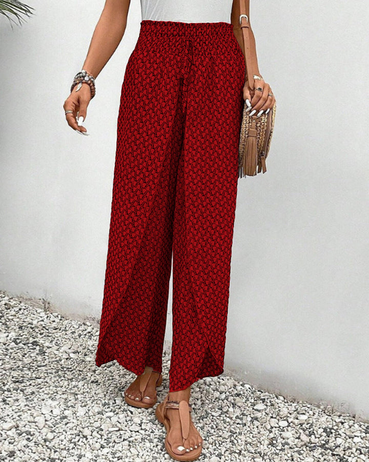 Patterned wide leg women's trousers with a relaxed fit. Modern geometric design, highly comfortable fashion.