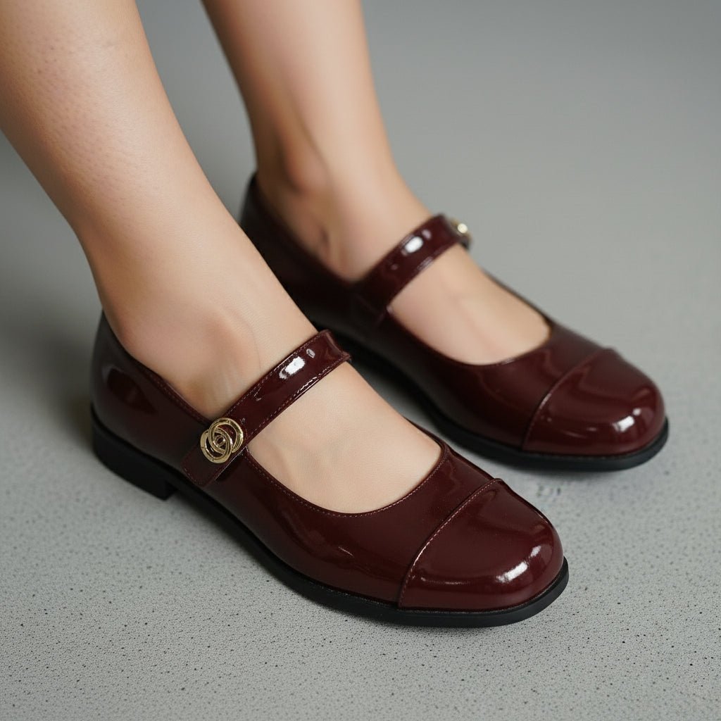 Women's classic Mary Jane flats with wide toe box & arch support, complementing a chic outfit.