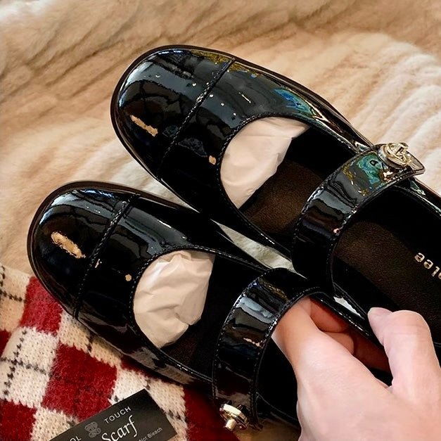 Elegant women's Mary Jane flats, combining wide toe box & arch support with timeless patent style.
