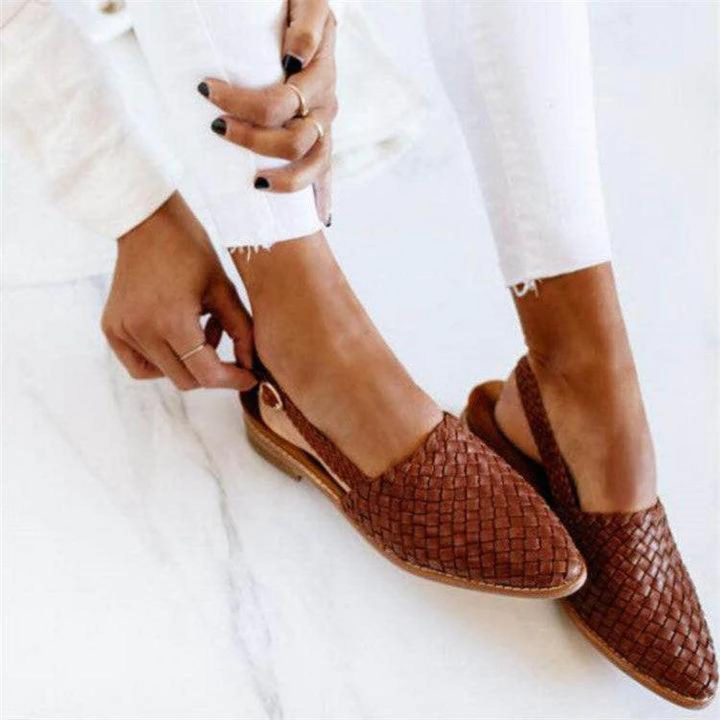 Women's woven ballet flats in a classic round-toe design, perfect for elegant summer wear and everyday comfort.