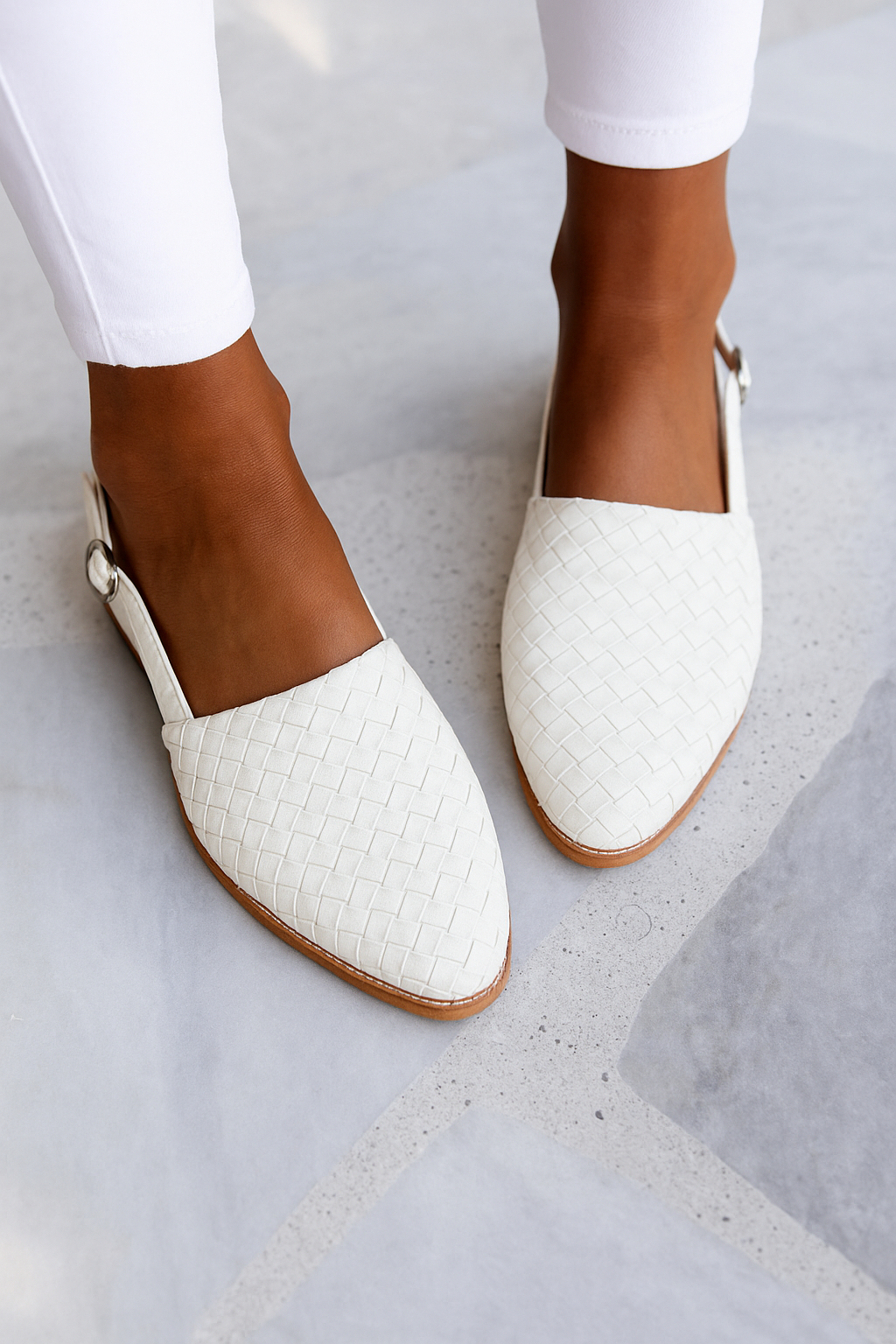 Comfortable women's closed toe mules with a stylish woven upper, easy slip-on design.