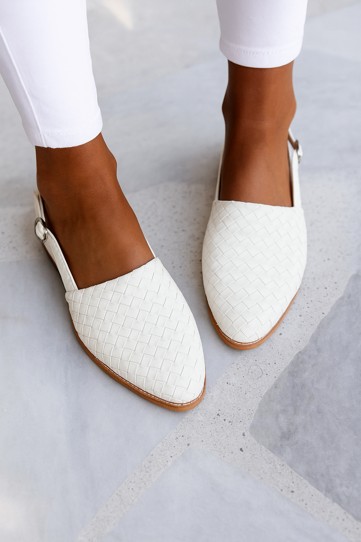 Comfortable women's closed toe mules with a stylish woven upper, easy slip-on design.