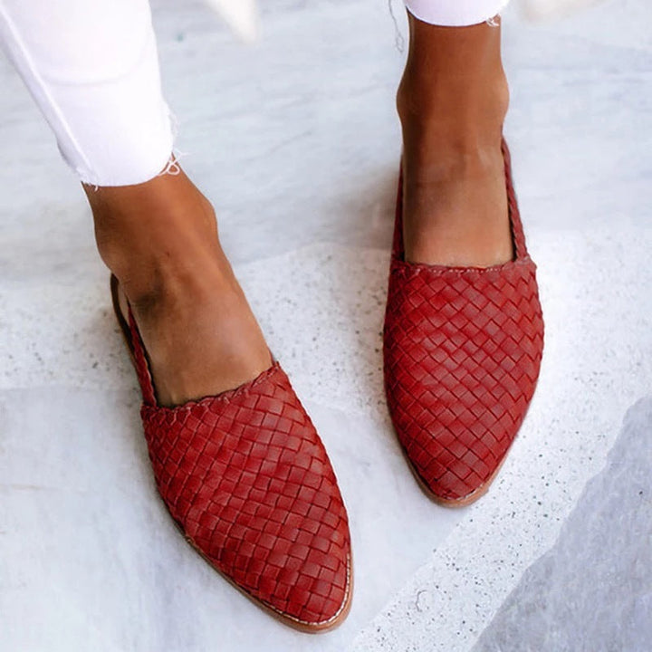 Comfortable women's slip-on mules with a stylish woven closed toe design.